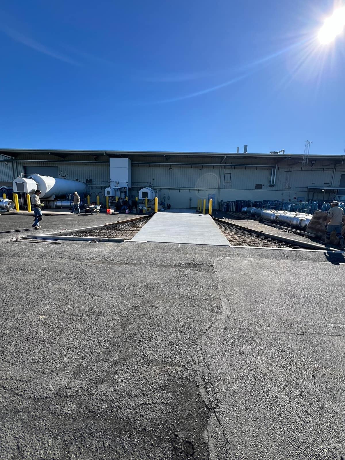 Cured equipment pad tied into the existing apron by MJS & Sons Construction