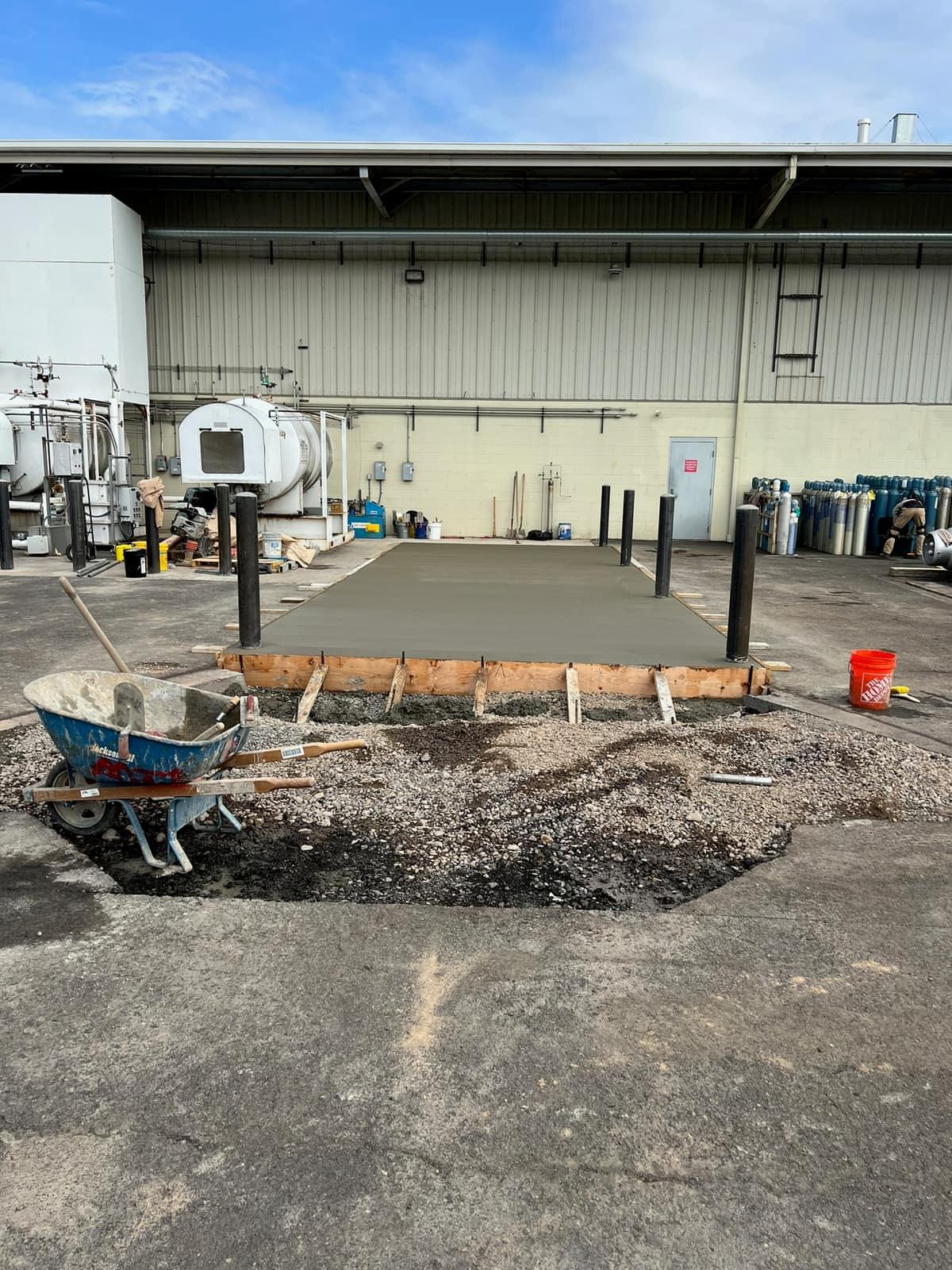 Concrete placed and finished on the equipment pad by MJS & Sons Construction