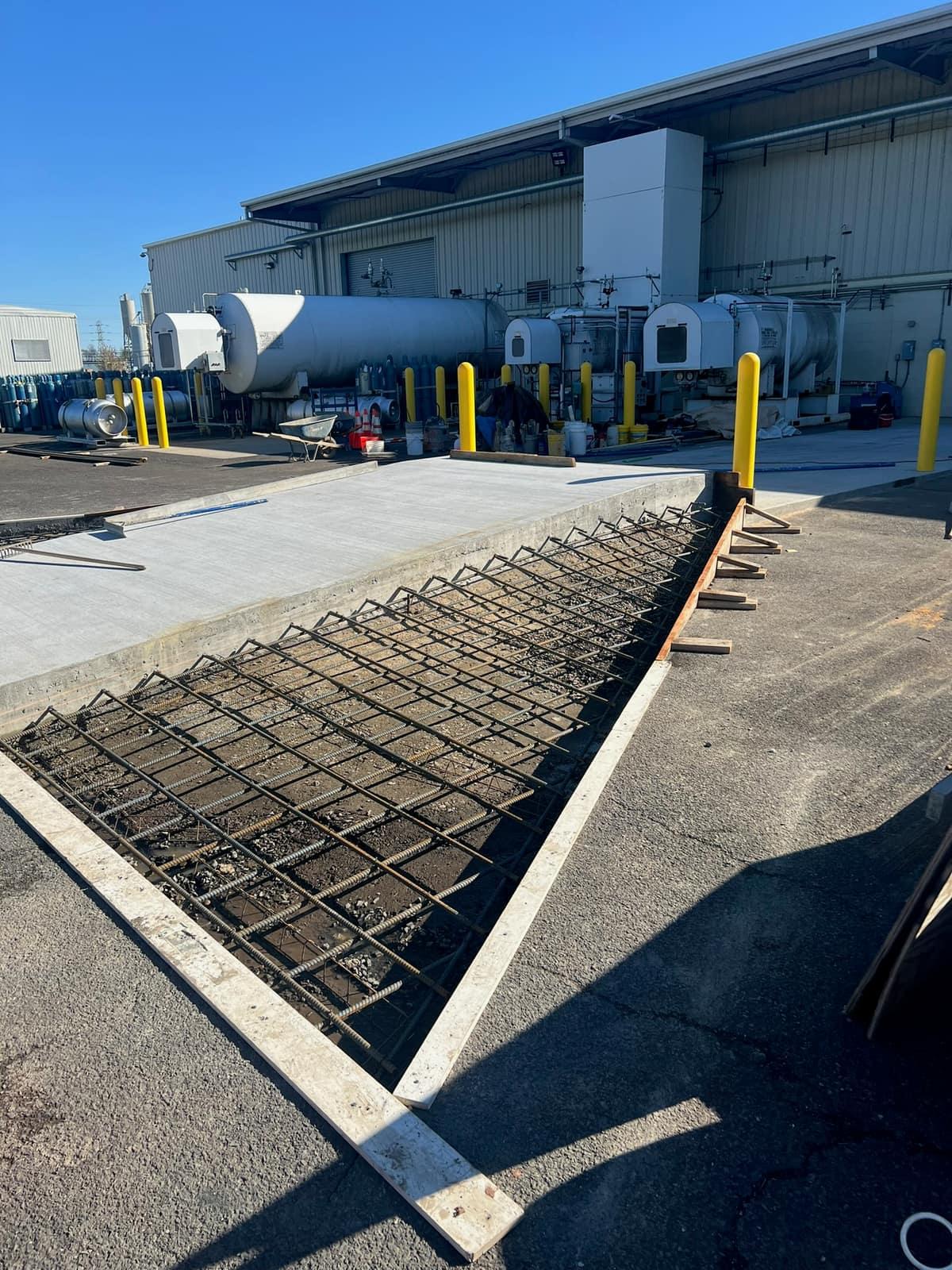 Equipment pad rebar and forms from an alternate angle by MJS & Sons Construction