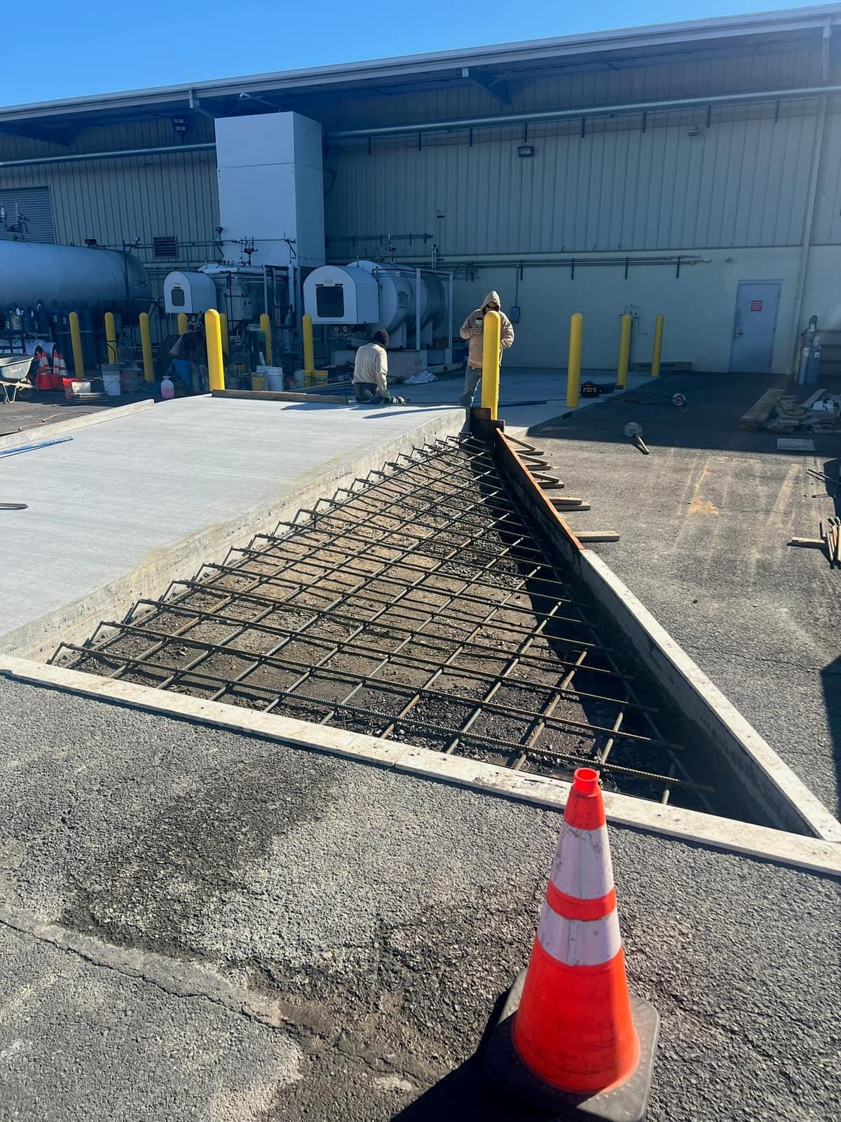 Excavated equipment pad with rebar mat and forms set by MJS & Sons Construction