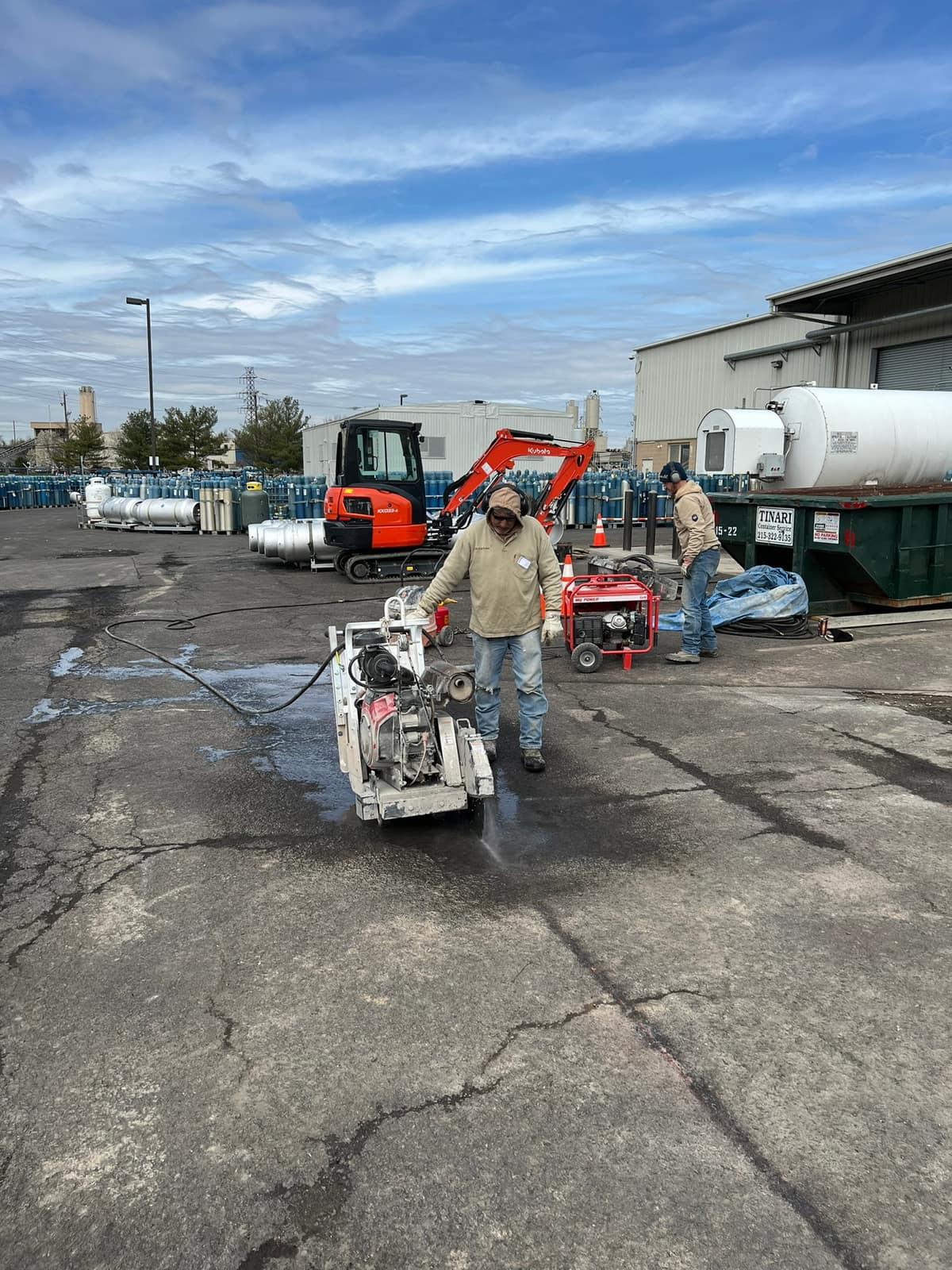 Diamond blade wet cut with water spray for dust control by MJS & Sons Construction