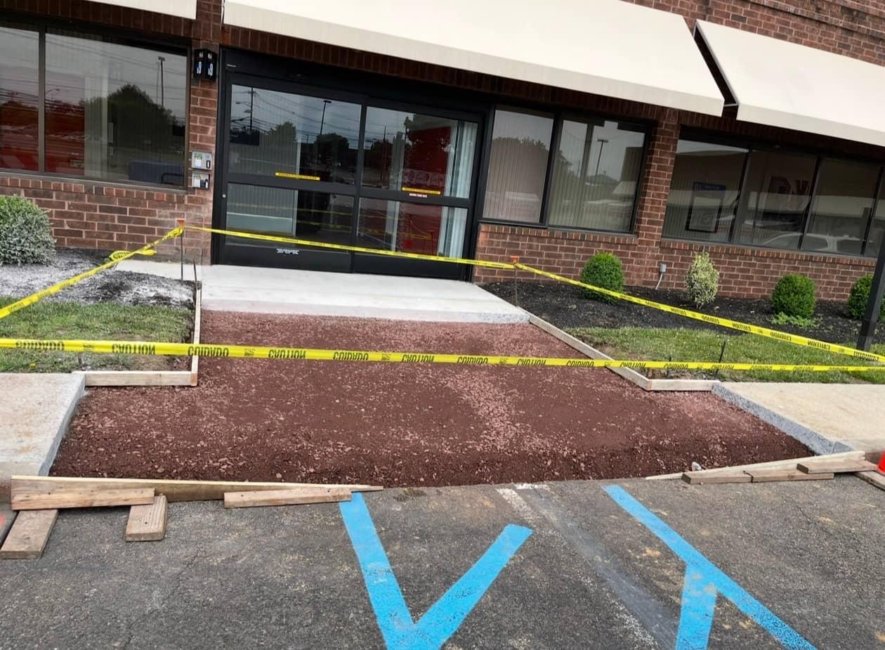 Commercial entrance walkway before replacement by MJS & Sons Construction