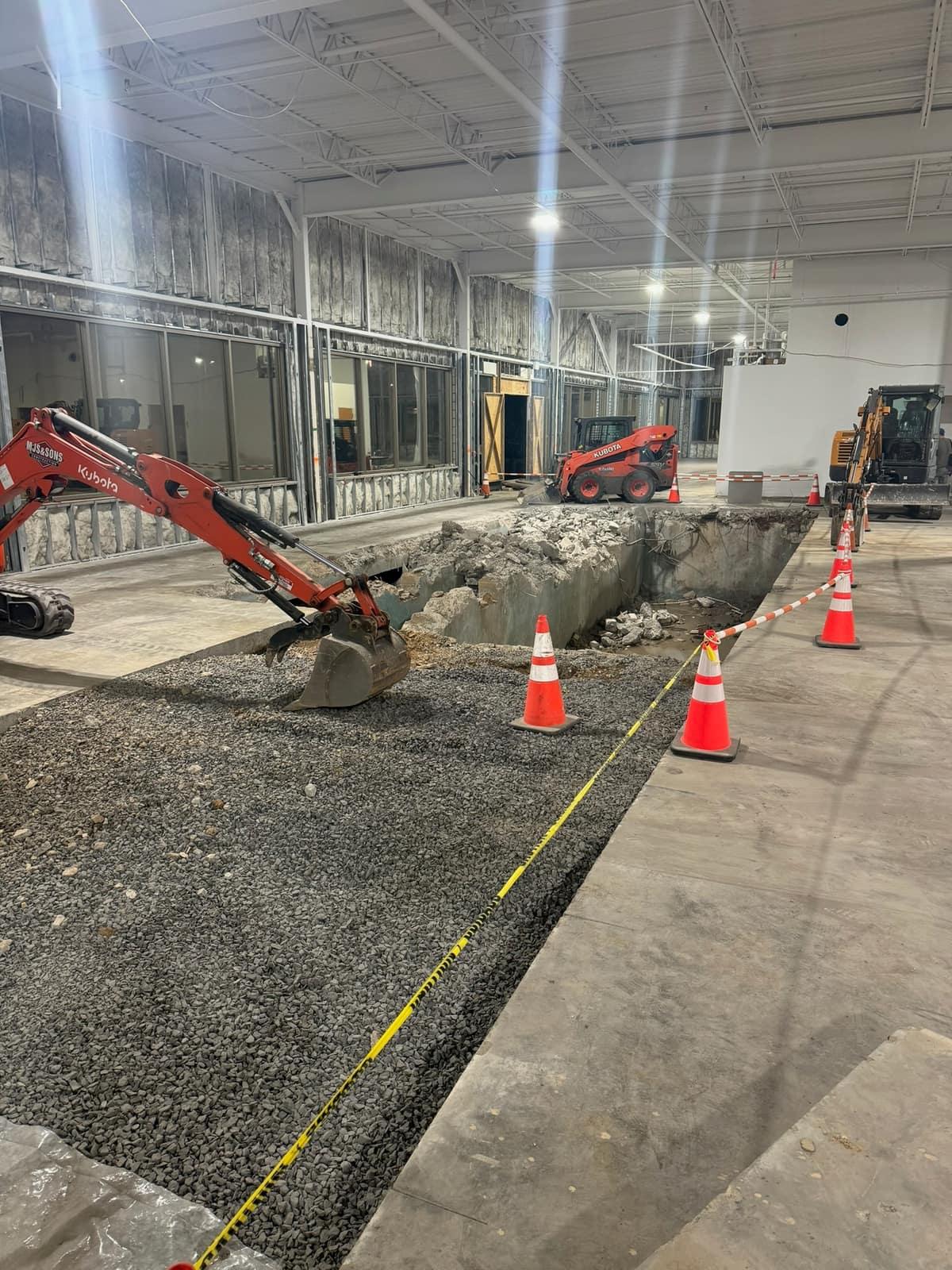 Saw cut and excavation of the existing slab with the MJS Kubota by MJS & Sons Construction
