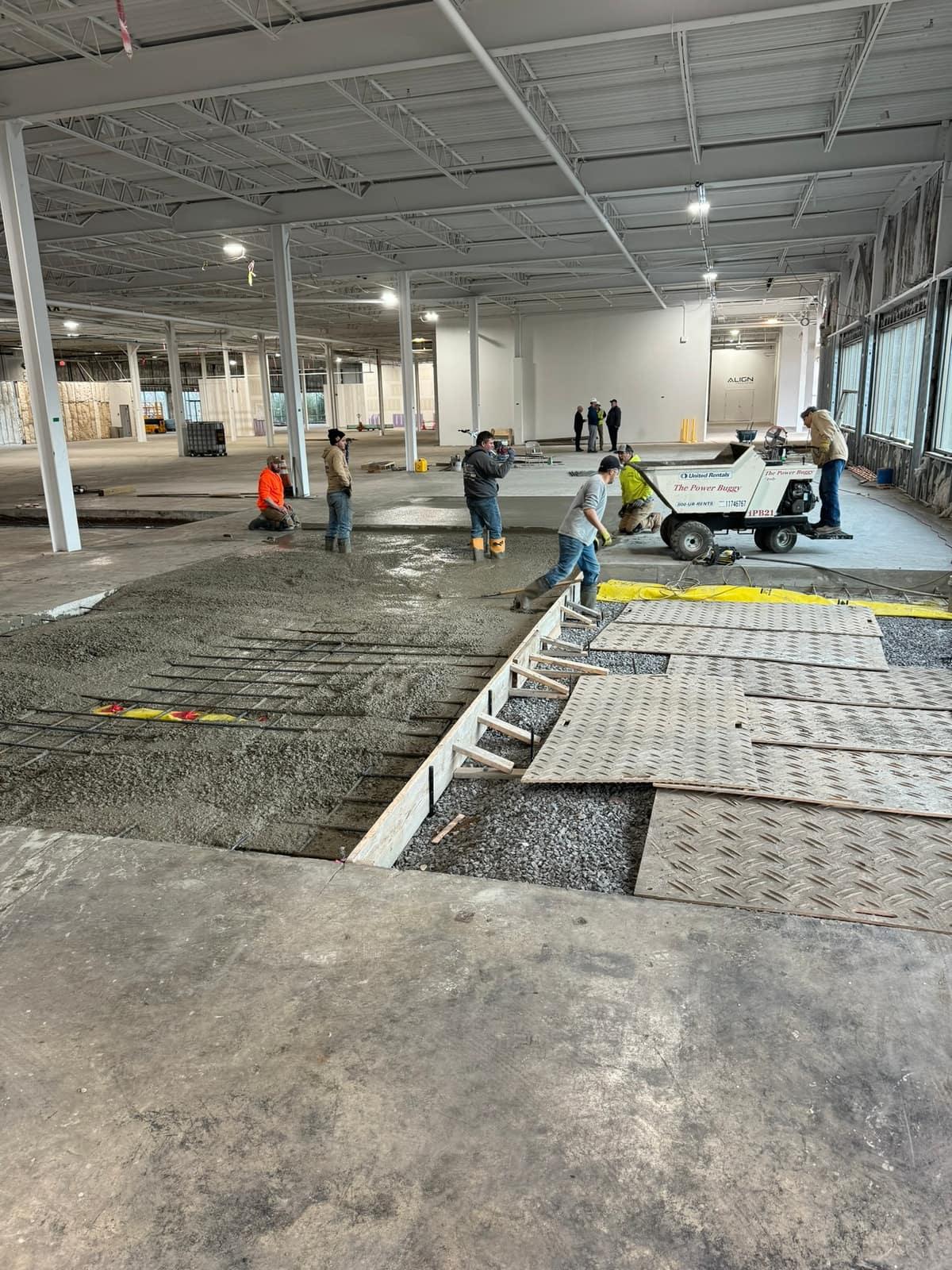 Placing concrete with a power buggy by MJS & Sons Construction