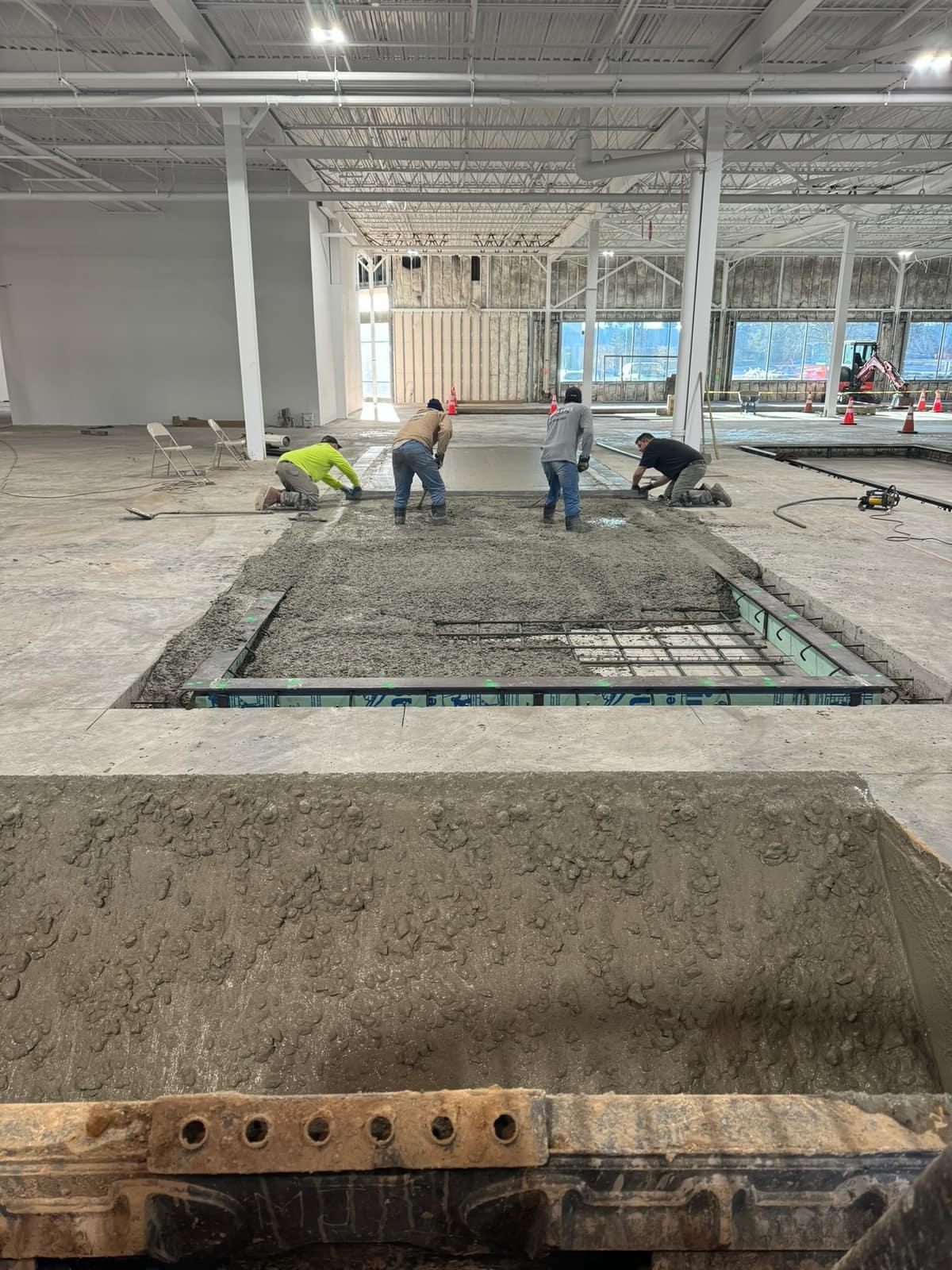 Concrete placed with the crew finishing the foundation by MJS & Sons Construction