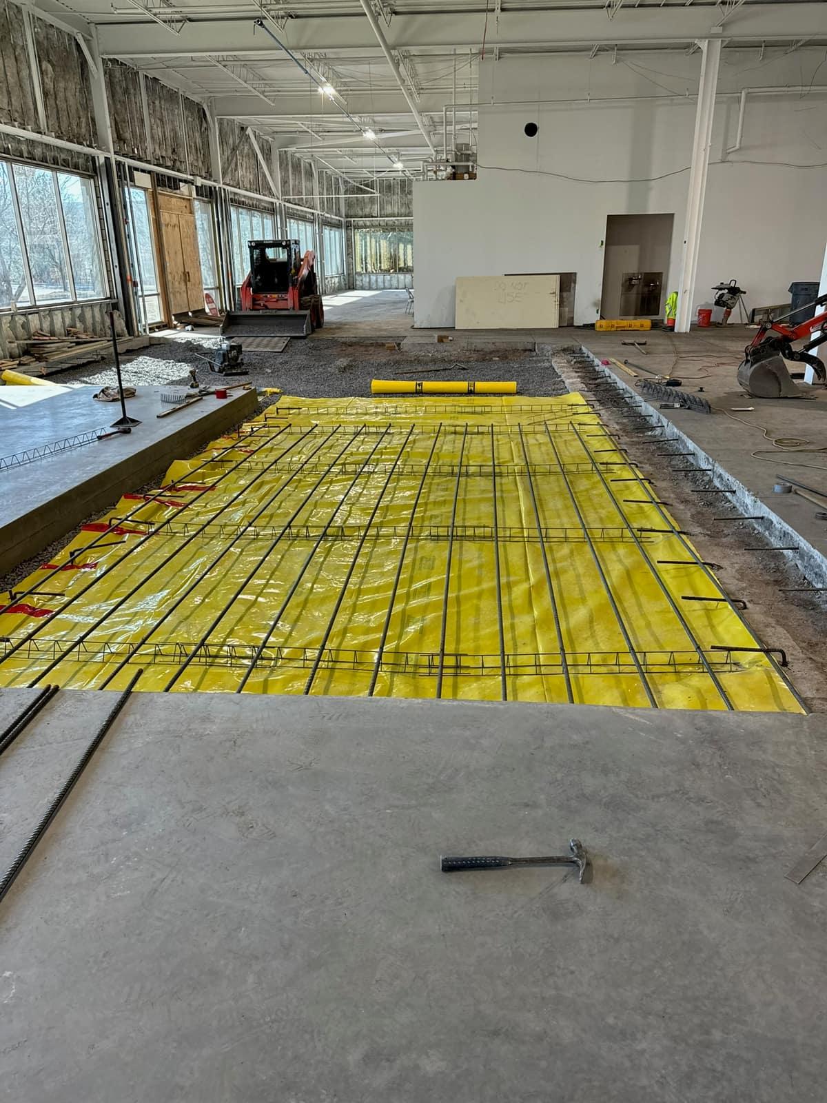 Vapor barrier and rebar set in the foundation by MJS & Sons Construction