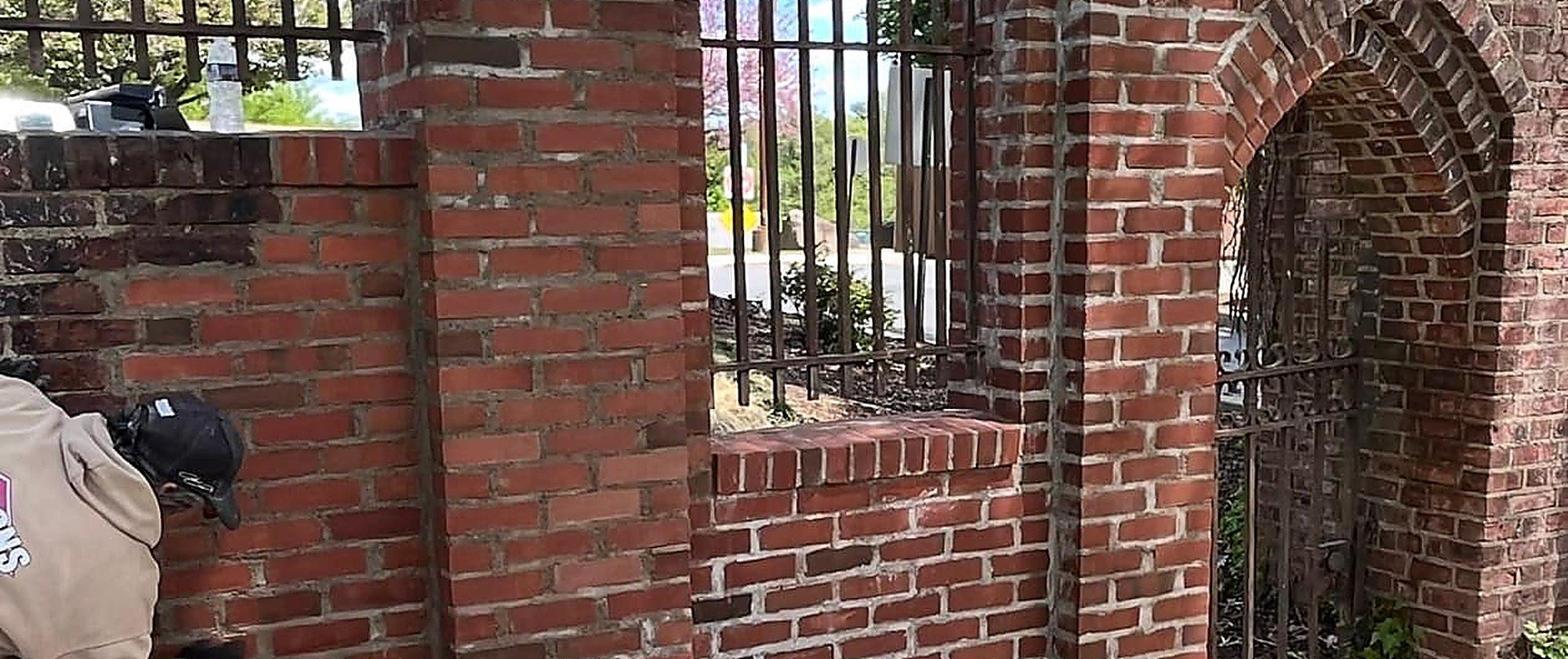 Repointed Sacred Heart stone gate after restoration by MJS & Sons Construction