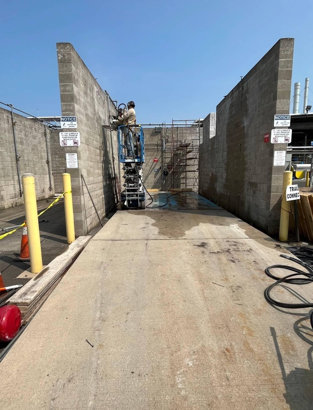 Block wall corridor lift industrial by MJS & Sons Construction