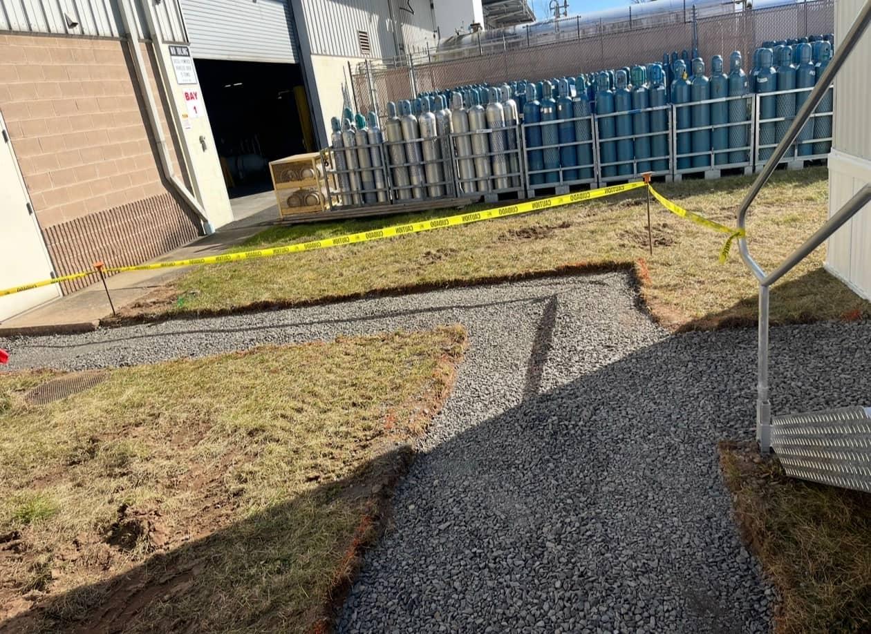 Industrial walkway gravel prep by MJS & Sons Construction