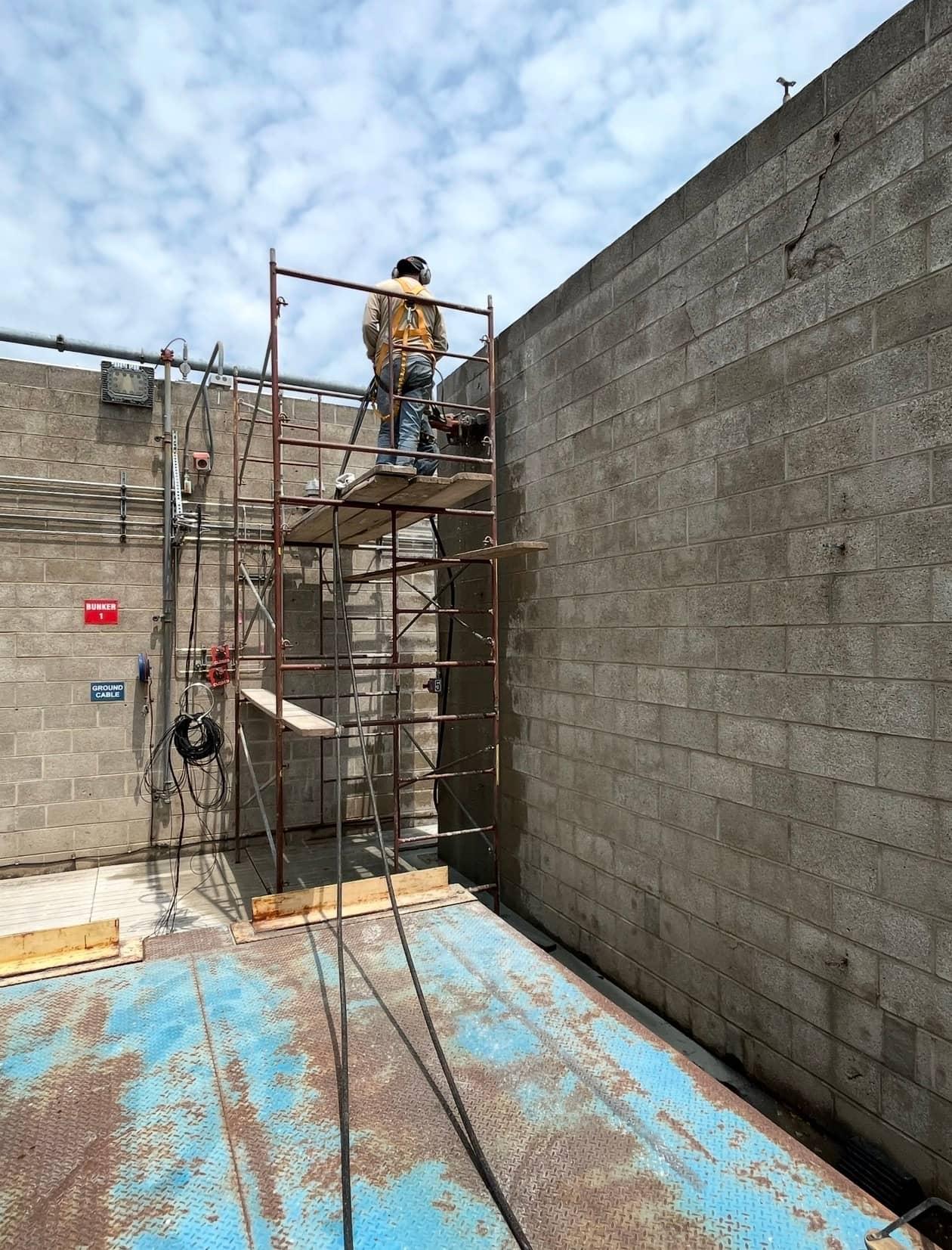 Mason scaffold block wall corner by MJS & Sons Construction