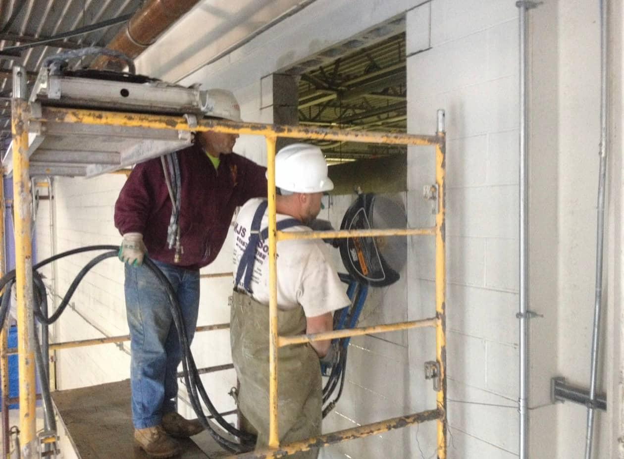 Wall saw crew scaffold opening by MJS & Sons Construction